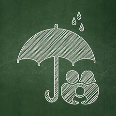 Image showing Security concept: Family And Umbrella on chalkboard background