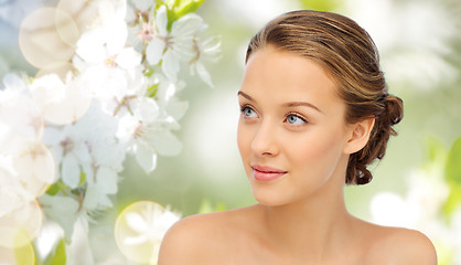 Image showing smiling young woman face and shoulders