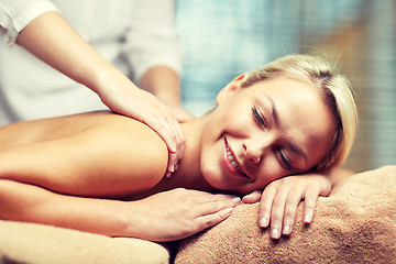 Image showing close up of woman lying and having massage in spa