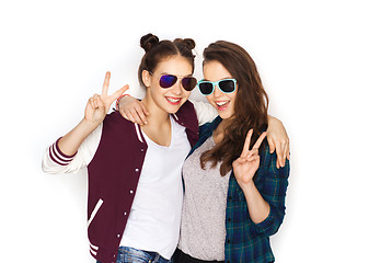 Image showing smiling teenage girls in sunglasses showing peace