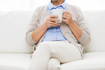 Image showing close up of senior woman with tea cup at home