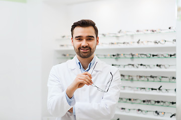 Image showing man optician with glasses in coat at optics store