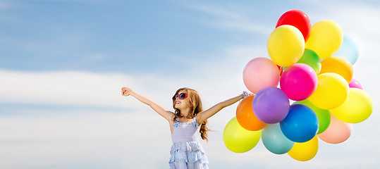 Image showing happy girl with colorful balloons