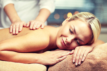 Image showing close up of woman lying and having massage in spa