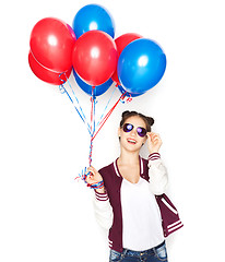 Image showing happy teenage girl with helium balloons