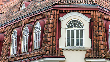 Image showing Mansard windows on a tile roof of the house in Tallinn, a close 