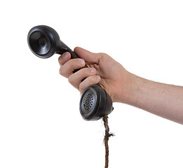 Image showing Male hand holding retro landline telephone