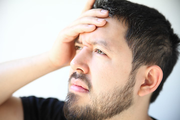 Image showing Young man with head pain