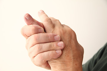 Image showing Man has pain in pinky finger.