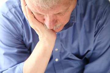 Image showing Older man slumped in depression