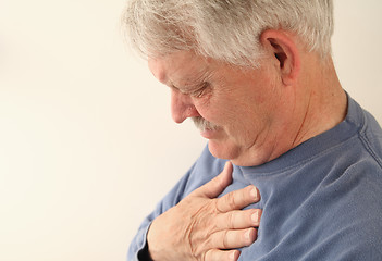 Image showing Senior suffers from heartburn or chest pain