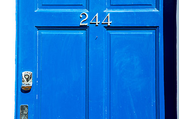 Image showing  blue in london    brass nail and light