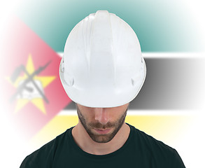 Image showing Engineer with flag on background - Mozambique