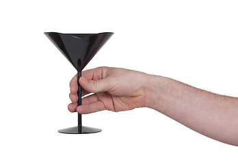 Image showing Black plastic coctail glass in hand