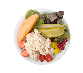 Image showing Snack time - View of Russian salad on a white plate