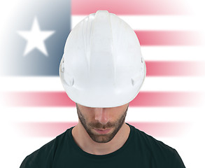 Image showing Engineer with flag on background - Liberia