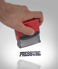 Image showing Plastic stamp in hand, Pressure