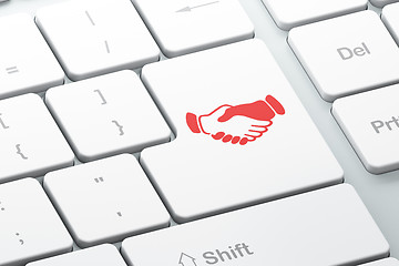 Image showing Finance concept: Handshake on computer keyboard background