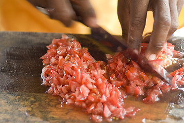 Image showing man preparing tomatoes for ceviche