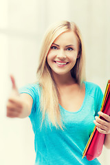 Image showing smiling student with folders