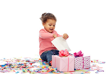 Image showing happy little baby girl with birthday presents