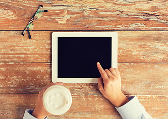 Image showing close up of female hands with tablet pc and coffee