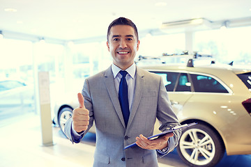 Image showing happy man at auto show or car salon