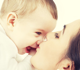 Image showing mother kissing her baby