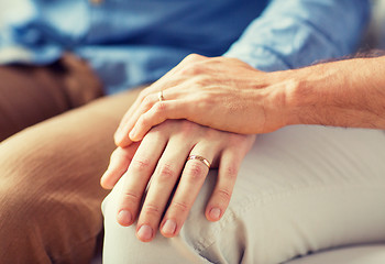 Image showing close up of happy male gay couple holding hands