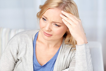 Image showing woman suffering from headache at home