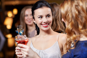 Image showing happy women with drinks at night club