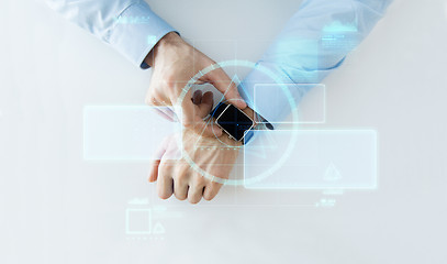 Image showing hand with smartwatch and virtual screen projection