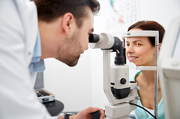 Image showing optician with tonometer and patient at eye clinic