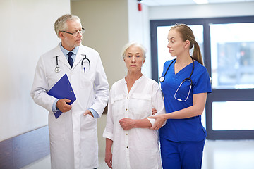 Image showing medics and senior patient woman at hospital