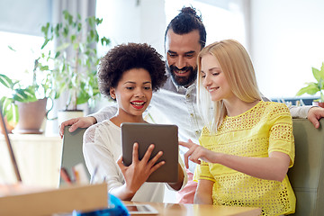 Image showing happy creative team with tablet pc in office