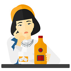 Image showing Sad woman with bottle and glass.