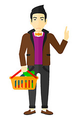 Image showing Man holding supermarket basket.