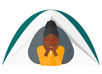 Image showing Woman lying in tent.