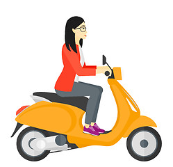 Image showing Woman riding scooter.