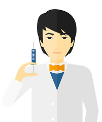 Image showing Doctor holding syringe.