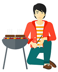 Image showing Man preparing barbecue.