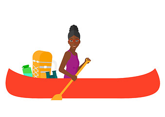 Image showing Woman riding in canoe.