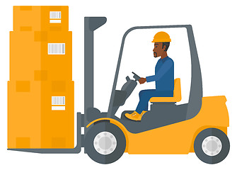 Image showing Worker moving load by forklift truck.