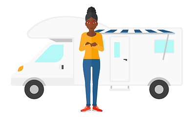 Image showing Woman standing in front of motor home.