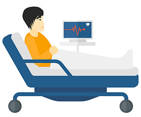 Image showing Patient lying in bed with heart monitor.