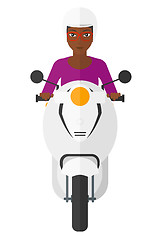 Image showing Woman riding scooter.