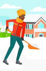 Image showing Woman shoveling and removing snow.