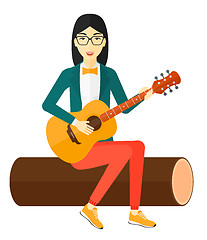 Image showing Woman playing guitar.