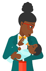Image showing Woman feeding baby.