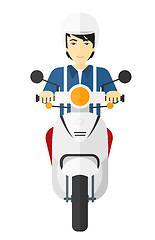 Image showing Man riding scooter.